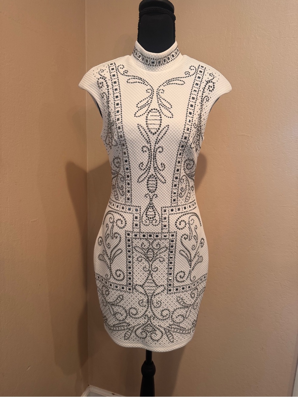 HOT! bebe White Mock Neck Bodycon Mini Dress with Gunmetal Embellishments